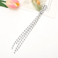 Detailed view of white braided phone lanyard rope with black patterns and knotted ends - White Style (K3877)