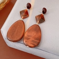 Macro shot of boho resin and wood drop earrings with amber texture and gold plating - Silver Earring Post - Coffee - Oval