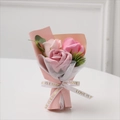 Detailed view of mini pink soap rose bouquet with elegant Love Is Eternal ribbon - Light Pink