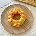Polka dot fabric scrunchie in bright yellow color on a minimalist wooden tray - Yellow with White Polka Dots