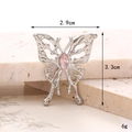 Silver hollow bow shoe charm with pink gemstone on marble background measuring 3.3cm - Hollow Butterfly Pink