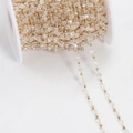 Bohemian gold bead chain with transparent square crystals on a white spool roll - Transparent KC Gold (Square Beads)