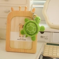 Luminous green plush turtle keychain with white geometric patterns on a wooden frame - Green (Style 14) / 10cm