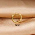 Close-up of a 7mm small golden hoop earring with polished finish on champagne silk fabric - 1PC / 7mm / Gold