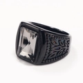 Macro shot of black titanium ring with rectangle gemstone and hollow pattern - Black Mineral Black Gemstone