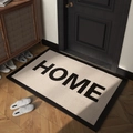 Ορθογώνιο χαλάκι πόρτας HOME σε κρεμ χρώμα με μαύρο περίγραμμα σε ξύλινο δάπεδο - 50*80cm / HOME-Λευκό