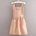 Brown canvas apron with white polka dots, featuring ruffles and dual front pockets - Canvas Lettered - Khaki Dots