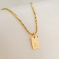 Detailed close-up of 18K gold plated square pendant with engraved letter L on box chain - Letter L