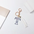 Letter T keychain with colorful ethnic motifs, white fringe tassel and rose gold hardware - Letter T (With Tassel)