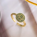 Detailed macro view of gold plated Hamsa Hand ring with green zircon micro-inlay - Adjustable Open / Green