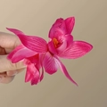 Magenta artificial orchid hair clip with realistic textures and vivid orange stamen - Rose Red Cymbidium