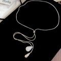 Detail of silver snake chain necklace with white marble teardrop and adjustable slider - Silver-White