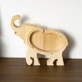 Detail of wooden elephant piggy bank with transparent acrylic panel and screw fasteners - Elephant