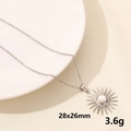 Silver sun pendant necklace with radiant beams on elegant white ceramic tray - Sunburst Radiance Pendant / Silver