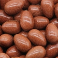 Polished egg-shaped goldstone gemstones with sparkling red-brown finish for Easter - Goldstone (Synthetic) (1pc)