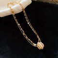 Collar de doble capa dorada con cuentas de ojo de tigre y colgante de circonita brillante - Dorado