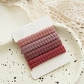 Detail of five seamless pink gradient elastic hair ties on a white display card - Gradient Ribbed / Dusty Rose (4 Pcs/Card)