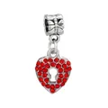 Macro shot of silver heart charm with red rhinestones and keyhole detail for bracelets - 32-Lock Hole Heart