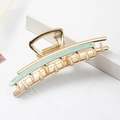 Detail view of large golden hair claw clip with light green enamel inlay on white background - Light Blue