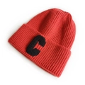 Classic red knit beanie featuring a black embroidered letter C patch on the folded cuff - Light Red