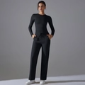 Front view of black long-sleeve yoga set with high-waist drawstring wide-leg pants - S / Black