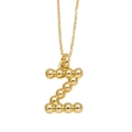 Golden necklace with letter Z pendant made of polished metal beads on a fine chain - Letter Z