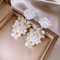 Detailed macro view of white 3D flower earrings with faux pearls on champagne silk - 3D Iridescent Rose Pearl Tassel Earrings (11#)