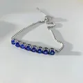 Adjustable silver ball chain bracelet featuring eight deep blue round-cut crystals - Silver Blue Zirconia (SBP451)