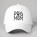 Close-up of DOG MOM print with paw icon on white cotton baseball cap with curved brim - One Size / White