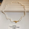 Baroque freshwater pearl necklace featuring a golden heart-shaped magnetic clasp closure - 18K Gold Heart Magnetic Freshwater Pearl Necklace