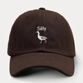 Close-up of Silly duck embroidery on a dark brown cotton twill baseball cap - Coffee