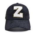 Close-up of black leopard print baseball cap featuring distressed fabric and a large 'Z' patch - Letter Z Style (Z-漏洞马尾棒球帽)