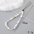 Handmade phone strap with white pearls and gold letter C bead on a grey background - Pearl Letter C