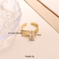 Macro detail of a gold beaded ring featuring a marquise-cut clear zircon stone - White