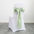 Light green satin chair sash tied in a bow on a white chair cover for weddings - Grass Green