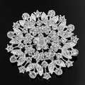Close-up of radiant silver flower brooch with sparkling rhinestones on black background - XD-105 Silver Rhinestone