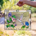 Close-up of stained glass hummingbirds and flowers panel with black metal frame - Style 1 (Green Hummingbird)