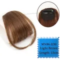 Detail view of light brown clip-in bangs showing breathable lace net and BB clips - Light Brown-2/30