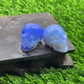 Blue and white 2.8cm hand-carved natural stone crystal skulls on a wooden base - Blue Opalite