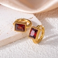 Detail of vintage gold huggie earrings featuring a rectangle red crystal on stone - Square Zircon / Red