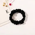 Detail of high-elastic black satin scrunchie with soft silk texture on white background - Satin Thin Scrunchie-Black