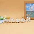 Detailed view of white and gold wooden Christmas train with festive cartoon characters - White (5 sections)