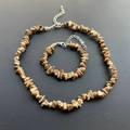 Detailed macro view of natural irregular picture jasper stone necklace and bracelet set - Bracelet / Jasper