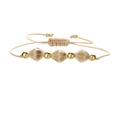 Handgewebtes Armband mit geometrischen Marmor-Keramikperlen und goldenen Metallakzenten - Bronzeperle & Erdfarben