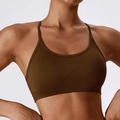 Seamless coffee brown sports bra with thin straps and ribbed support band on model - Brown