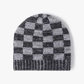 Winter knit beanie with black and white checkerboard pattern and ribbed cuff design - Black