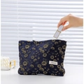 Navy blue canvas makeup bag with golden daisy patterns and white logo label - Large / Dark Blue Gold Daisy
