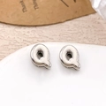 Elegant silver letter Q stud earrings with smooth metallic finish on white ceramic tray - Silver Letter Q