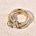 Detail of four-layer mixed metal ring featuring polished silver and gold beaded bands - US 6 / Gold