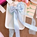 Light blue bow hair clip with satin and organza long ribbons for volume - Blue